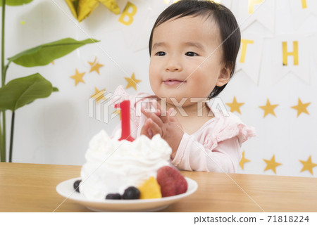 1st birthday celebration and birthday cake 71818224