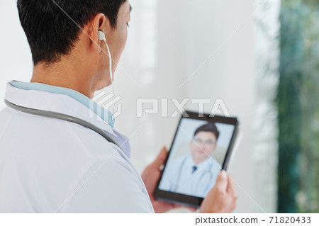 Physician making video call 71820433