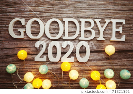 Goodbye 2020 alphabet letter with cotton ball LED decoration on wooden background 71821591
