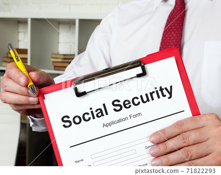 Clerk offers a Social Security benefits form to fill in. 71822293
