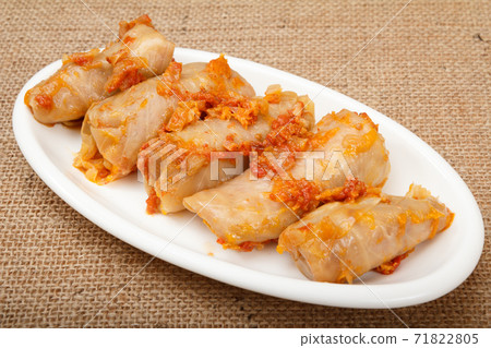 Delicious homemade cabbage rolls stuffed with rice and meat on dish. Delicious homemade cabbage rolls stuffed with rice and meat on dish. 71822805