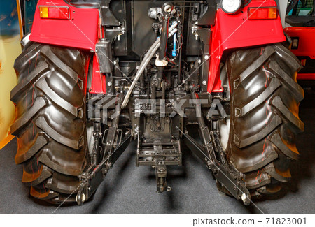 Hydraulic hitch of an industrial tractor close-up. Hydraulic hitch of an industrial tractor close-up. 71823001