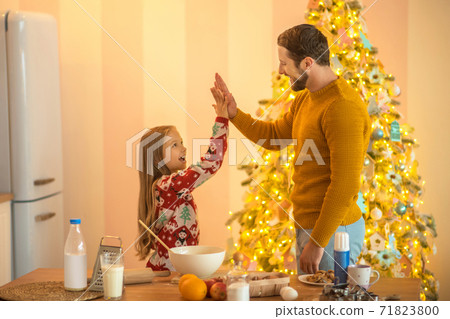 Girl and her dad feeling good and doing high five Girl and her dad feeling good and doing high five 71823800