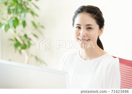 A young woman working on a computer A young woman working on a computer 71823896