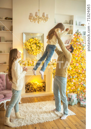 Dad holding his daughter in the air and feeling happy Dad holding his daughter in the air and feeling happy 71824065