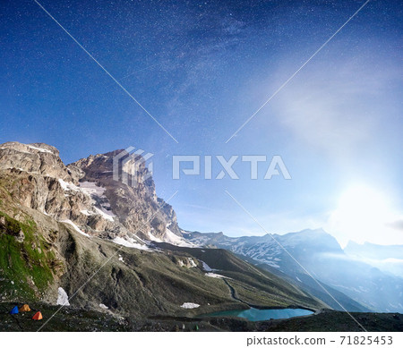 Beautiful starry sky over Matterhorn, Monte Cervino mountain. Beautiful starry sky over Matterhorn, Monte Cervino mountain. 71825453