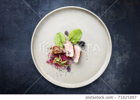 Traditional fried pork fillet with salad and fruits  71825897