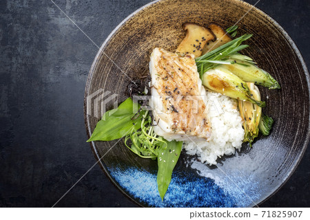 Traditional Japanese fried skrei cod fish filet with bok choi and rice Traditional Japanese fried skrei cod fish filet with bok choi and rice 71825907