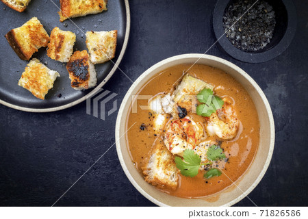 Traditional French fish soup with prawns and croutons Traditional French fish soup with prawns and croutons 71826586