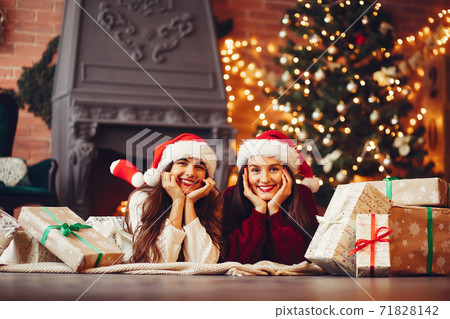 Beautiful girls have fun in a studio Beautiful girls have fun in a studio 71828142