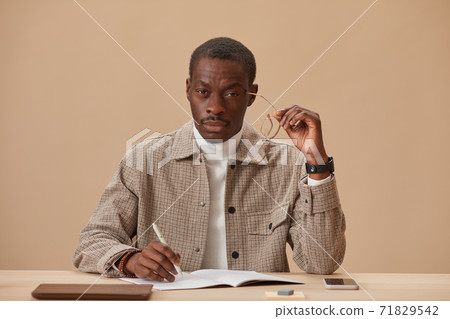 Businessman working at his workplace 71829542