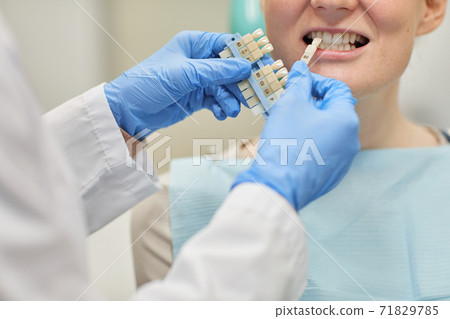 Treating teeth at clinic Treating teeth at clinic 71829785