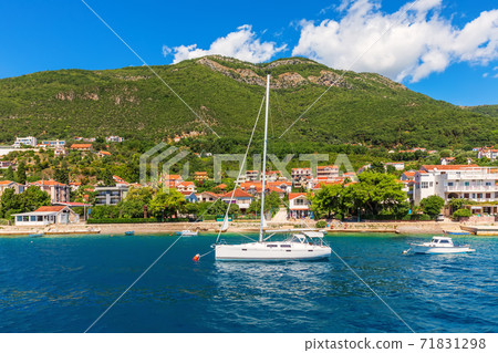 Yachts near the Adriatic coast in the Bay of Kotor, Montenegro 71831298