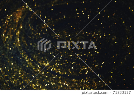 Gold glitter on dark blue bokeh abstract light defocused background. 71833157