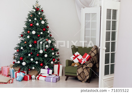 Beautiful Christmas decor of residential white room with stucco Beautiful Christmas decor of residential white room with stucco 71835522