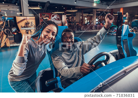 Beautiful girl smiles and rejoices for the guy.  71836831