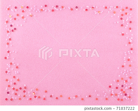 Set of beads on a pink background. Set of beads on a pink background. 71837222