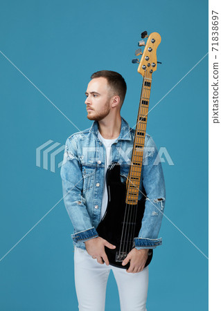 handsome man in denim with guitar 71838697
