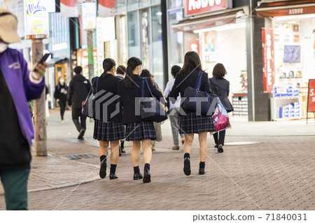 Back view of a high school girl in uniform walking in Shibuya Center Gai 71840031