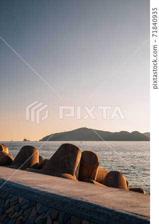 Haeundae seascape with breakwater at sunset in Busan, Korea Haeundae seascape with breakwater at sunset in Busan, Korea 71840935