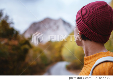 Outdoor fashion photo of young beautiful lady surrounded autumn forest in mountains 71845379