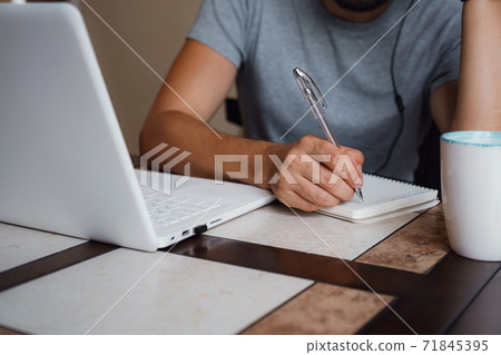 Focused young man wear headphones study online Focused young man wear headphones study online 71845395