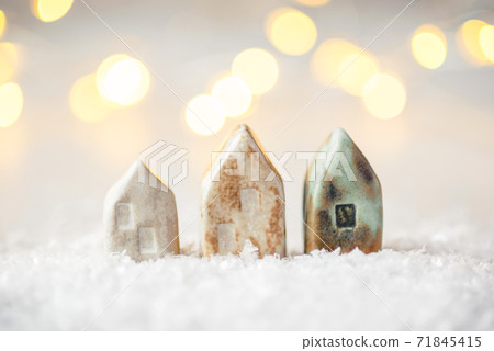 Ceramic figurines of houses in the snow. 71845415