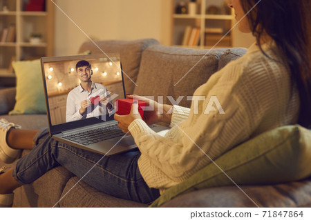 Young man and woman in love having virtual date via video call on Valentine's Day Young man and woman in love having virtual date via video call on Valentine's Day 71847864