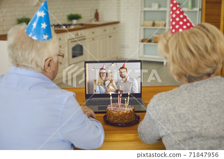 Grandparents video calling their little grandchild and wishing him Happy Birthday 71847956