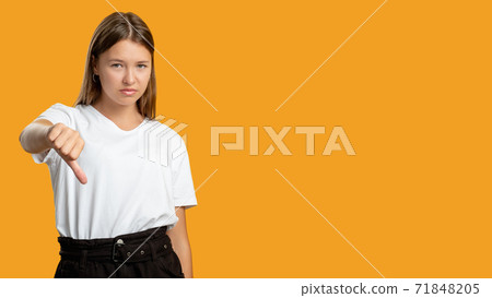 dislike gesture disappointed teen girl thumb down dislike gesture disappointed teen girl thumb down 71848205