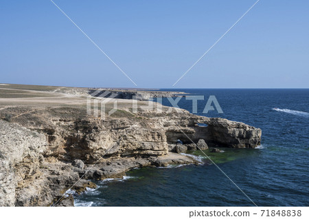 Crocodile - shaped rocks on the Bank of the Tarkhankut national nature Park in the village of Olenevka Crocodile - shaped rocks on the Bank of the Tarkhankut national nature Park in the village of Olenevka 71848838