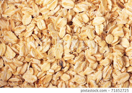 Rolled oats background. Close up view. Flat lay style. Rolled oats background. Close up view. Flat lay style. 71852725