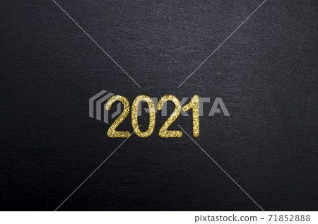 Happy New year 2021. Golden digits 2021 flat lay with copy space on black background. Golden numbers 2021. 2021 background. Happy New year 2021. Golden digits 2021 flat lay with copy space on black background. Golden numbers 2021. 2021 background. 71852888