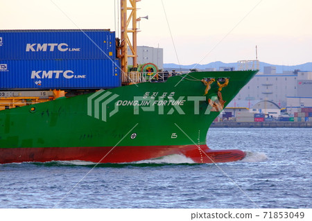 A large cargo ship entering the port of Osaka A large cargo ship entering the port of Osaka 71853049