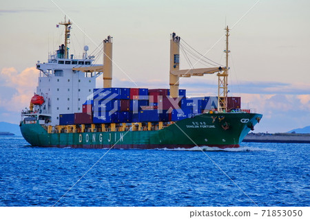 A large cargo ship entering the port of Osaka A large cargo ship entering the port of Osaka 71853050