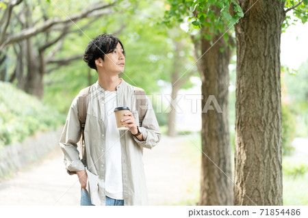 A man taking a walk over coffee 71854486