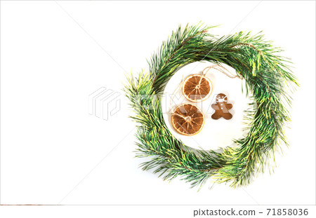 Christmas composition. Cookies in the form of a man in a mask. Holiday concept in the context of the coronavirus pandemic 71858036