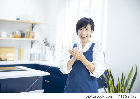 Woman in the kitchen 71858452