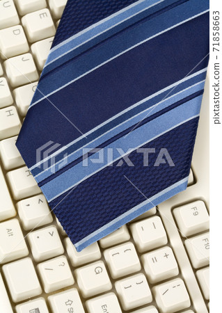 Blue Necktie and Keyboard 71858663