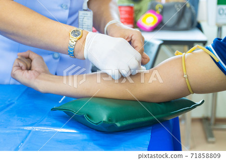 doctor injection needle on arm to collect blood for test the health selective focus syringe 71858809