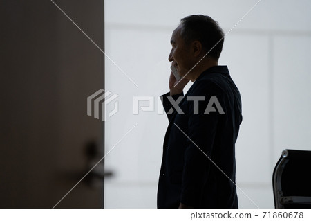 Back view man making a phone call Back view man making a phone call 71860678