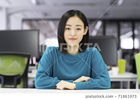A young woman looking at the camera 71861973