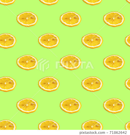 Seamless pattern with lemon slices on a salad background. Minimal isometric texture of food. Use for boards, print on fabric. 71862642