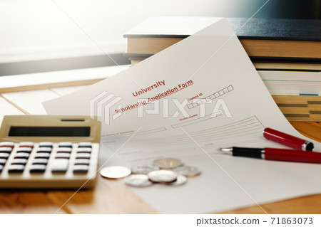school scholarship application form on wooden table school scholarship application form on wooden table 71863073