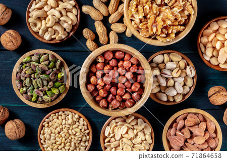 Nuts variety flat lay. Many different nuts, shot from the top 71864658