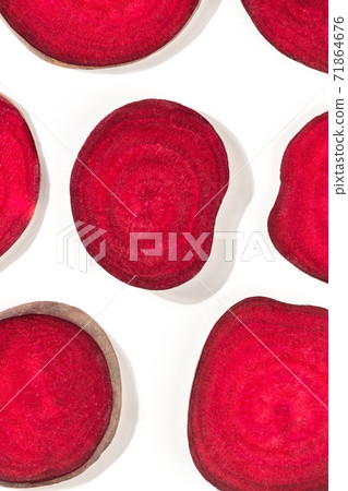 Beetroot texture. Slices of beet, shot from the top on a white background Beetroot texture. Slices of beet, shot from the top on a white background 71864676