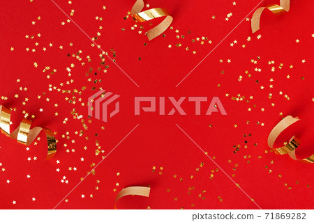 Golden swirls and sparkles on red background. Golden swirls and sparkles on red background. 71869282