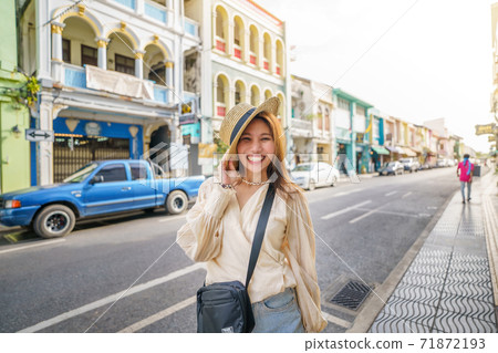 Travelers on street Phuket old town with Building Sino Portuguese architecture at Phuket Old Town area Phuket, Thailand. Travel concept 71872193