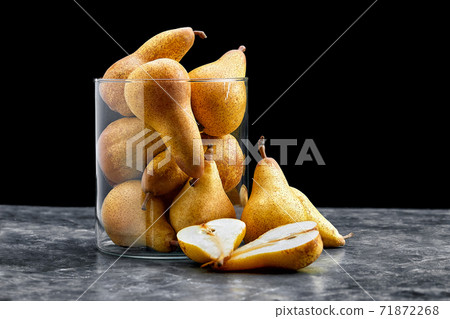 Ripe yellow pears on stone rustic background. Summer fruits, harvest. Ripe yellow pears on stone rustic background. Summer fruits, harvest. 71872268