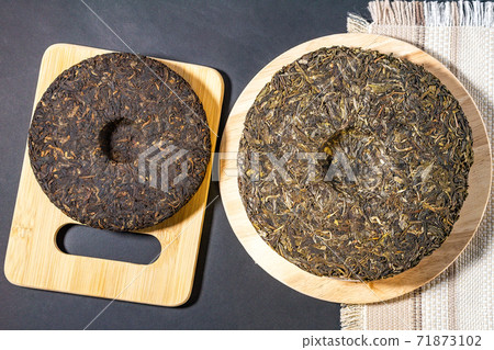 Chinese Tea Shu Shen Puer. Close-up. Pressed Tea. top view flat lay Chinese Tea Shu Shen Puer. Close-up. Pressed Tea. top view flat lay 71873102